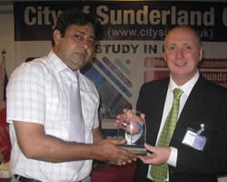 -17.8770818830827-trevor-ashton-(representative-of-sunderland-college-uk)-presenting-the-best-performance-shield-to-asif-amin