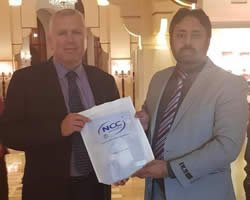 -25.6745549969722-andrew-rennie-(regional-director-of-ncc-uk)-is-presenting-ncc-uk-kit-to-asif-amin