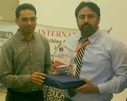 -7.81260575531638-mr.-amjad-country-marketing-manager-jang,-the-news-and-geo-group-presenting-shield-to-asif-amin